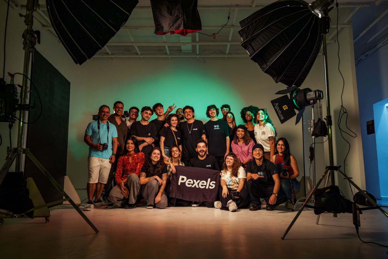 services-04 A diverse group of adults posing in a professional photography studio.